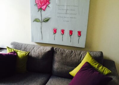 Waiting room with artwork and couch