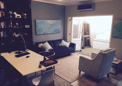 Consulting room with couch and armchair